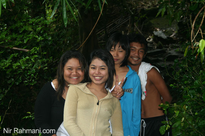 Thai people in Phuket jungle walk to a waterfall